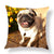 Custom Square Photo Pillow featuring a happy pug in a vibrant outdoor setting with yellow flowers.